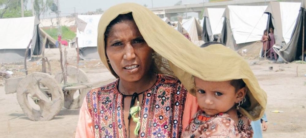 An elderly woman has her lunch in the sun at Adibasi Sahi, India. The extreme heat is impacting hundreds of millions of people in the country. — courtesy UNICEF/Soumi Das