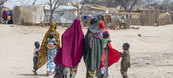 A displaced family walks through Ouallam camp in Niger. — courtesy UN Photo/Eskinder Debebe
