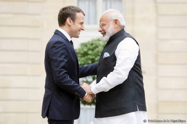 Indian Prime Minister Narendra Modi is welcomed by French President Emmanuel Macron in Paris on Wednesday.