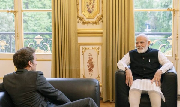 Indian Prime Minister Narendra Modi is welcomed by French President Emmanuel Macron in Paris on Wednesday.