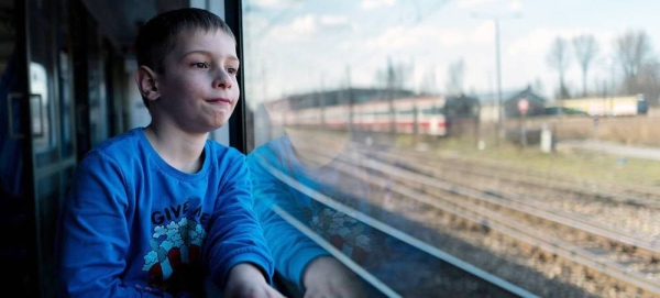 
A six-year-old boy rides in a train along the Poland-Ukrainian border in Medyka, after fleeing the conflict in Ukraine with his mother. — courtesy UNICEF/Michal Korta