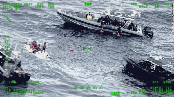 US Coast Guard and US Customs and Border Protection crews work to rescue dozens of people from the water near Puerto Rico.