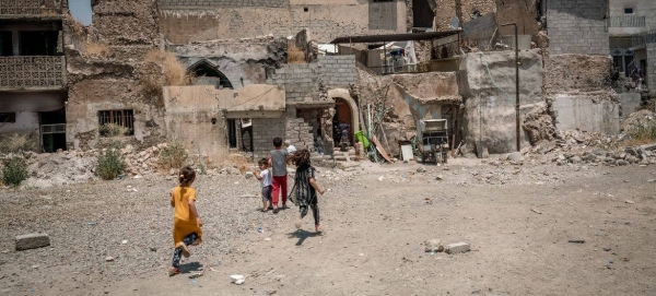 Children play in a neighborhood ravaged by conflict in Iraq.
