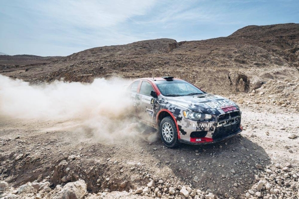 Nasser Saleh Al-Attiyah by the Jordan River at the lowest place on earth. 