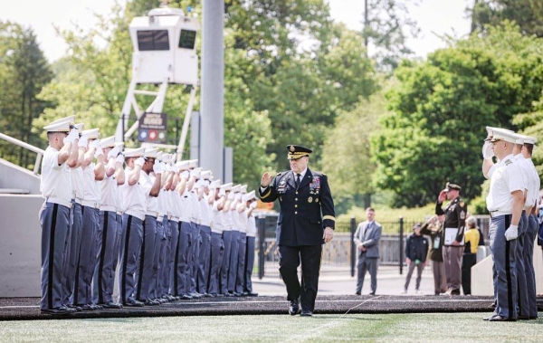 Army Gen. Mark A. Milley, chairman, Joint Chiefs of Staff, enters Michie Stadium through a cordon of cadets before his speech at their 2022 graduation and commissioning ceremony at the US Military Academy at West Point, N.Y., Saturday.