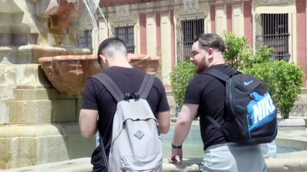 A person uses the protection of the umbrella to ward of the heat after temperatures soared this weekend, reaching up to 15 degrees above average for the season, in Spain.
