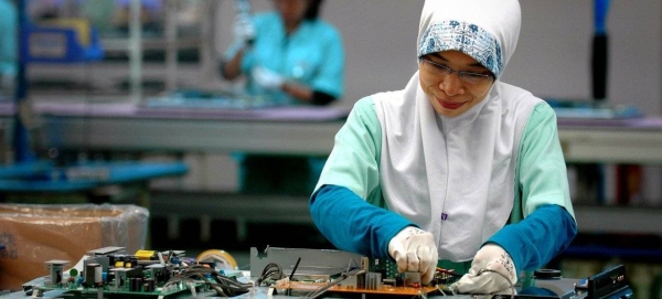 A woman works in an electronics factory in Cikarang, Indonesia.