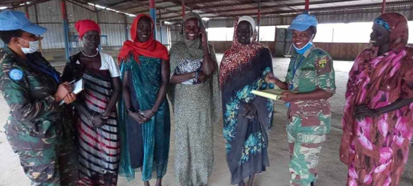 Following reports of sexual and gender-based violence against women collecting firewood in Rubkona, South Sudan, Captain Irene Wilson Muro and and Major Winnet Zharare (2nd from the right) reached out to local women to discuss ways to stem the abuse.
