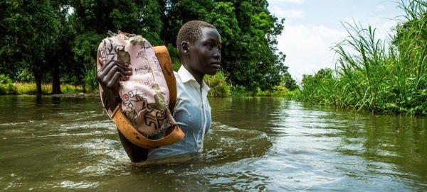 A girl walks home from school after the Nile river flooded on the outskirts of Juba, South Sudan.
