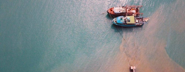 Boats docked near a port in Mombasa, Kenya. — courtesy Unsplash/Prolific Ke
