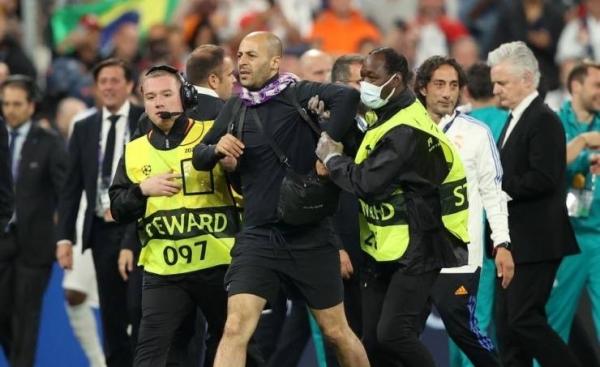 The match, which Real won 1-0, was delayed by more than 30 minutes after officers forcefully held back people trying to enter the Stade de France. Riot police sprayed tear gas on fans, including women and children.
