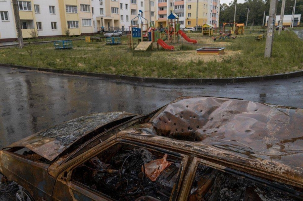 Distinctive marks from a cluster munition in the roof of a car next to a playground in Kharkiv.
