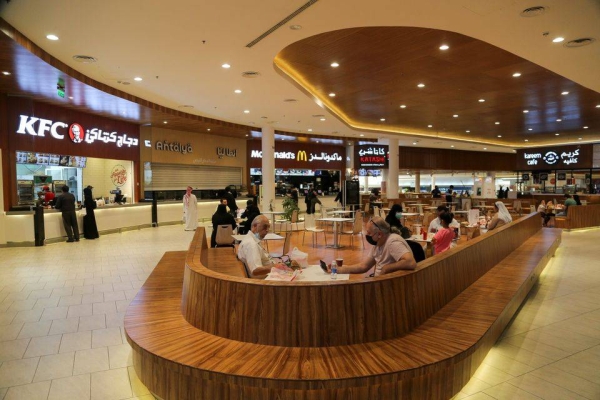 People eat at a food court in Riyadh.