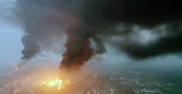 Thick black smoke blankets Shanghai skyline