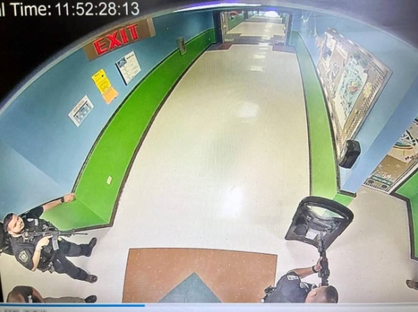 Photo purportedly showing police officers armed with rifles at Uvalde's school hallway at 11:52 local time on 24 May 2022. — courtesy Austin American-Statesman / KVUE-TV