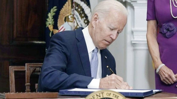 US President Joe Biden signs into law a gun control bill at the White House in Washington DC.