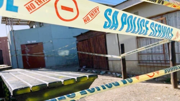 Yellow police tape now cordons off the drinking place in the South African city of East London where 21 teenagers died in unexplained circumstances.
