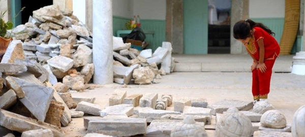 A girl looks at the ruins of the destroyed Othman Basha Sufi seminary in central Tripoli.