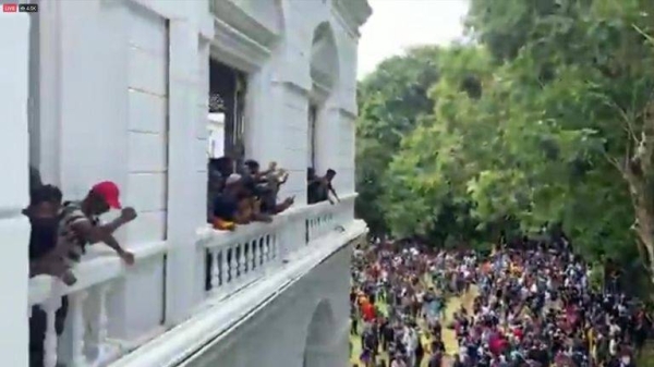 Sri Lankan president flees as protesters storm his residence