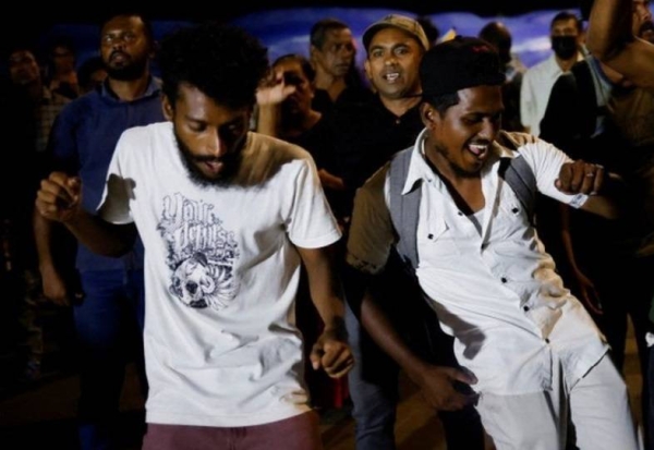 In the capital Colombo, delighted demonstrators greeted news of the president's departure with dancing.