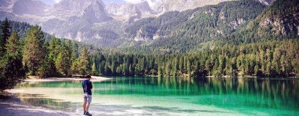 Lake Tovel is one of the most charming alpine lakes of the Dolomites located within the Adamello Brenta Natural Park in Trentino, Italy. — courtesy Unsplash/Manuel Venturini