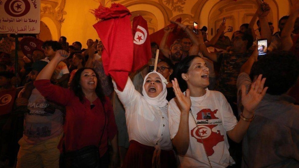 President Saied's supporters celebrated in the capital Tunis after an exit poll suggested voters had backed the reforms overwhelmingly.