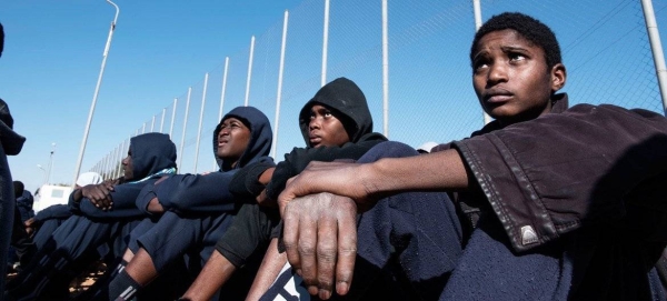 Migrants sit in the courtyard of a detention centre in Libya. (file)