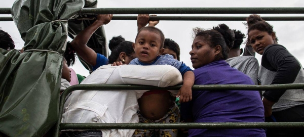 A family from arrive in Bilwi in Nicaragua after being evacuated prior to the arrival of Hurricane Iota.