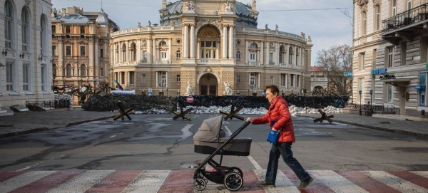 A woman crosses a boulevard in central Odesa in Ukraine.