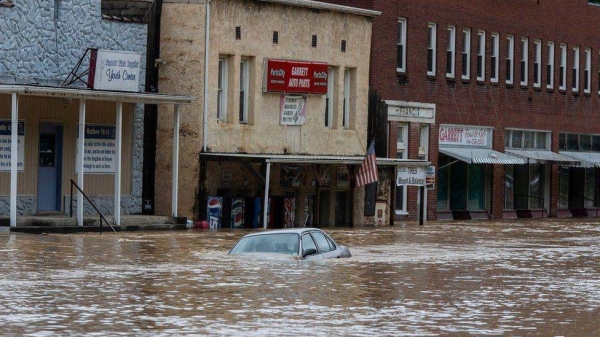 A car is submerged in flood waters along Right Beaver Creek, following a day of heavy rain in in Garrett, Kentucky, US July 28, 2022. (Reuters)