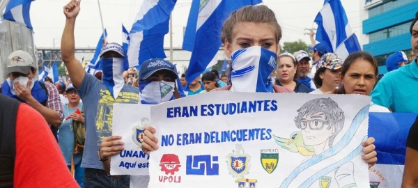 They were students, not criminals” reads a 2018 demonstrator's placard in Managua, Nicaragua. — courtesy (file) Artículo 66