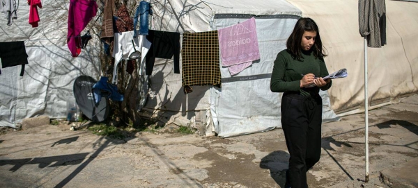 A 14-year-old Yazidi girl prepares for an exam in the Shekhan camp for internally displaced persons.