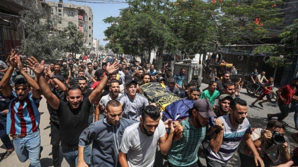 People attend the funeral of Palestinians, who lost their lives in Israel's attacks, in Rafah, Gaza on Sunday.. jpg
