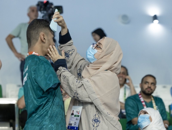 Saudi Paralympic swimmer Ibrahim Al-Marzouki’s mother is seen wiping off his sweaty face and preparing him to receive the bronze medal at Konya Islamic Solidarity Games 2022 in Turkiye on Tuesday. 

