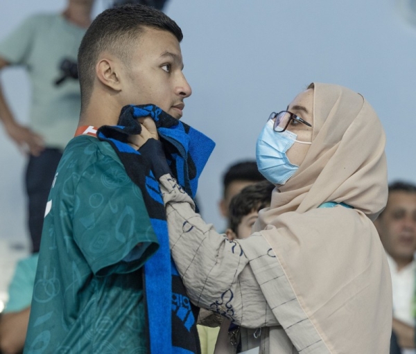 Saudi Paralympic swimmer Ibrahim Al-Marzouki’s mother is seen wiping off his sweaty face and preparing him to receive the bronze medal at Konya Islamic Solidarity Games 2022 in Turkiye on Tuesday. 

