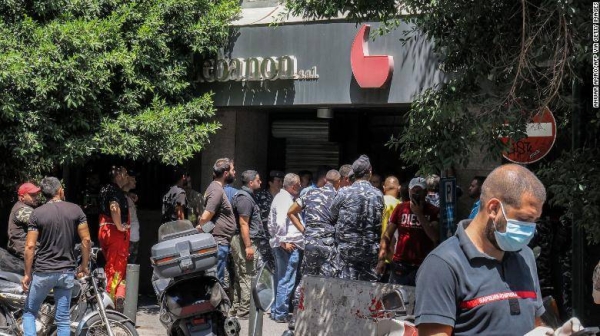 Security forces gather outside a Federal Bank branch in Lebanon's capital Beirut on Thursday.