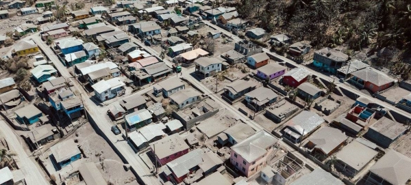 Ash from the eruptions of the La Soufrière volcano covers a town in St Vincent and the Grenadines.