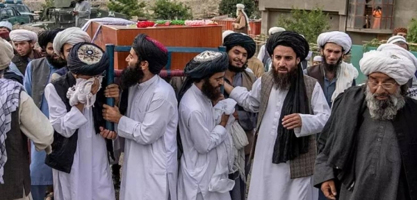 Mourners carry the body of a victim of a mosque bombing in Kabul, Afghanistan, Thursday.