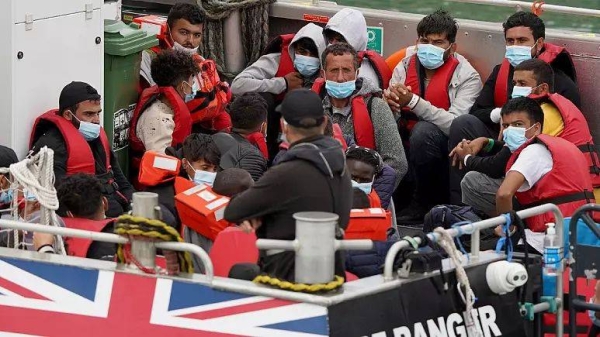 A group of people thought to be migrants are brought onboard a Border Force vessel to Dover, Kent, Monday.