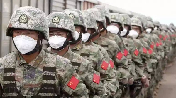 Chinese soldiers arrive to participate in war games drills in Grodekovo, Russia.