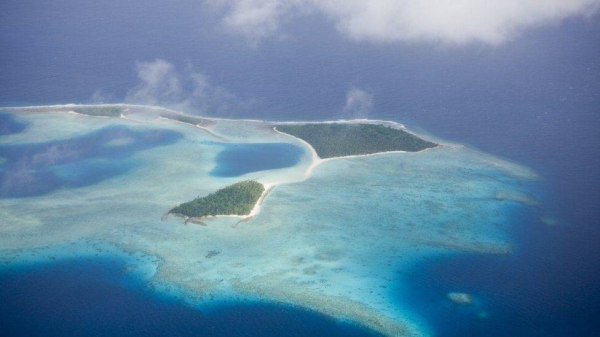 A Chinese couple plotted to set up a mini-state on the Marshall Islands in the Pacific, bribing MPs and officials along the way, US prosecutors say.