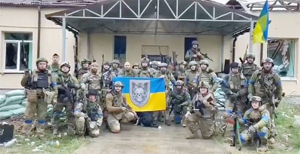 Ukrainian artillerymen prepare to fire a BM-21 Grad multiple rocket launcher near Izyum, south of Kharkiv, in this file picture.