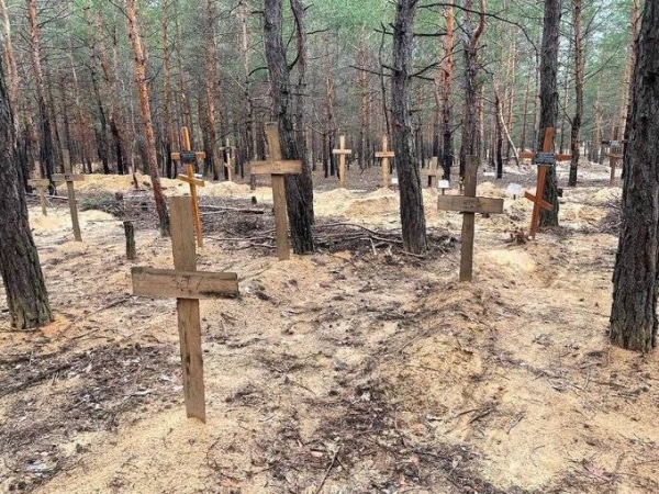 A mass burial found in the forest outside Izyum.