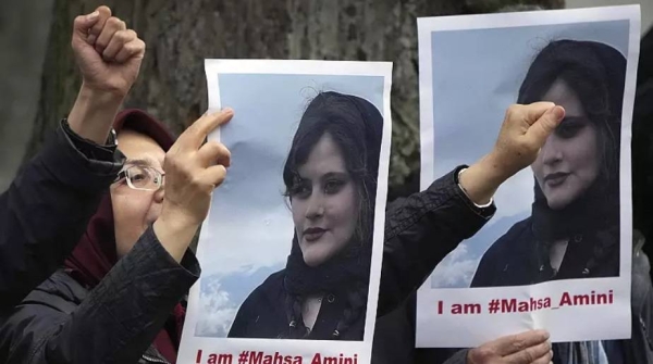 Exiled Iranians gather in protest in front of the Iranian embassy in Berlin.