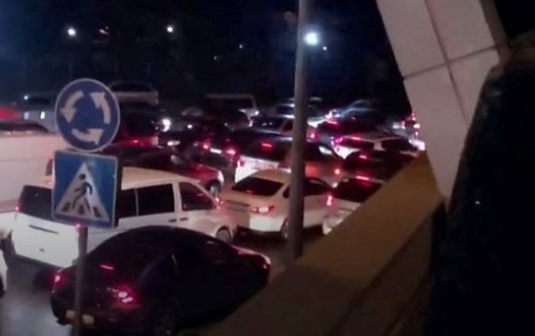 The photo appears to show large queues of vehicles at the Russia-Georgia border