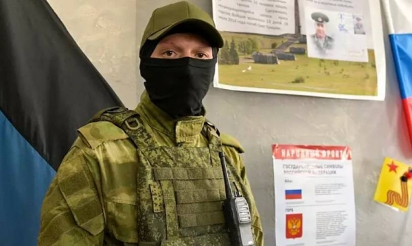 A serviceman guards the polling station prior to a referendum in Donetsk