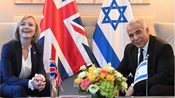 Yair Lapid (r) thanked Liz Truss for positively considering the move.