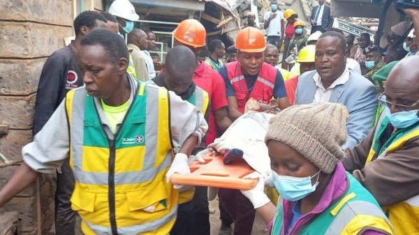 Rescue workers at the scene of a building collapse.