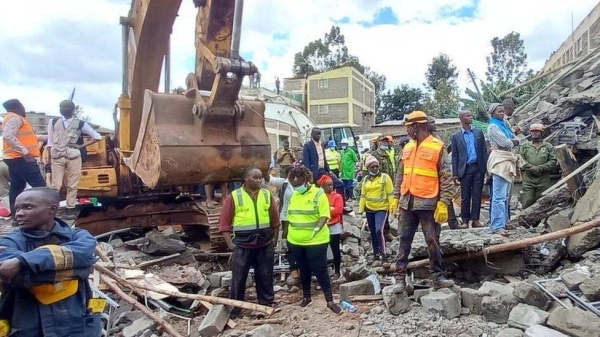 Rescue workers at the scene of a building collapse.