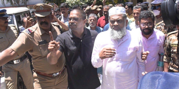 Popular Front of India members Yahiya Thangal, Karamana Asharaf Maulavi and P.K. Usman after being produced before a court following the nationwide raids by the NIA and ED, in Kochi, Kerala on September 24. JPG
